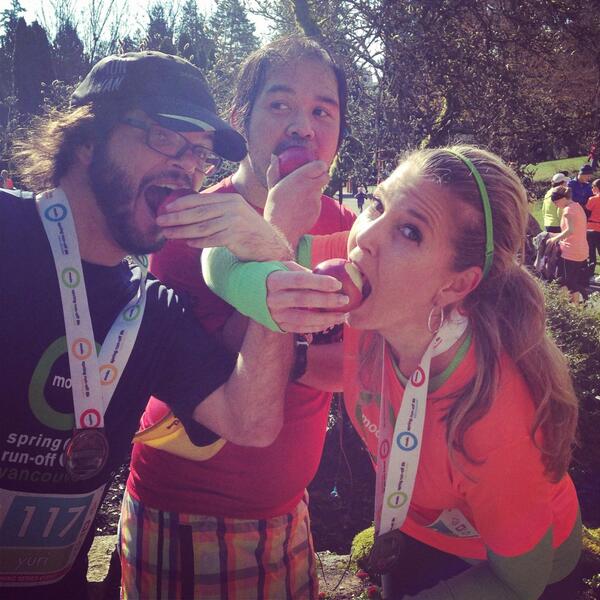 Happy racers eating Klippers organics apples at the finish line 